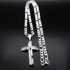 A silver-toned stainless steel layered cross pendant hangs from a matching curb chain.