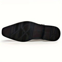 The underside of a black men's dress shoe features a textured pattern and a size 42 marking.