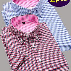 Two men's short-sleeve button-up shirts in red and blue checkered patterns with contrasting collars.