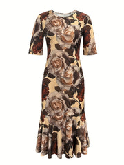 A retro-style midi dress featuring a floral print on a tan background with a crew neck and peplum hem.