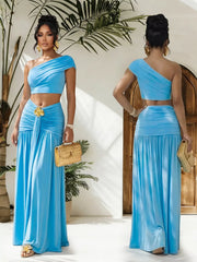 Trendsi one-shoulder top and ruched maxi skirt set featuring a stylish, coordinated look with a fitted top and flowing skirt.
