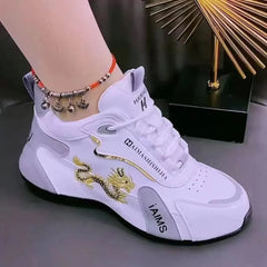A white lace-up sneaker for women featuring a gold embroidered dragon design on the side.