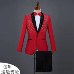 A red performance blazer with black lapels, rhinestone embellishments, and matching black trousers.