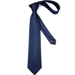 A solid navy blue silk necktie with a classic pointed tip and a pre-tied knot.