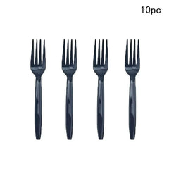 Four black plastic forks are arranged in a row against a white background.