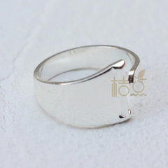 A silver-plated open ring with a smooth, minimalist band design on a white background.