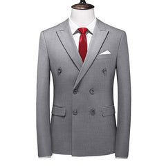 A grey double-breasted slim-fit suit jacket with a red tie and white pocket square.