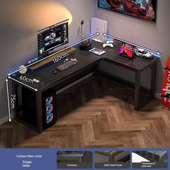 An L-shaped computer desk with a carbon fiber finish and a black steel frame.