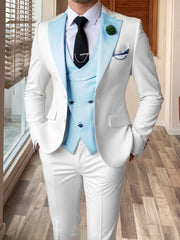 A slim fit white three-piece suit featuring a light blue vest and matching notched lapels.