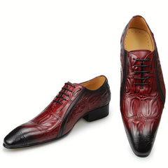 A pair of red and black pointed-toe derby shoes with a textured crocodile-print leather finish.