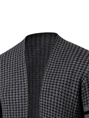 A close-up of a men's grey and black houndstooth knit cardigan with a stand collar.