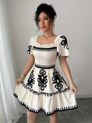 Elegant Mini Dress with a Square Neckline, Featuring Fashionable Prints, Pleats, a Cinched Waist for a Slimming Effect, And Ruffled Edges with an A-Line Hem.