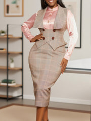A woman wears a plaid two-piece set featuring a sleeveless vest top and a matching slim skirt.