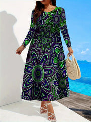 A woman wears a long-sleeved, A-line maxi dress featuring a purple and green dot-patterned design.