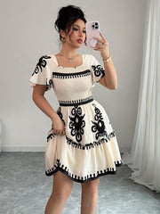 Elegant Mini Dress with a Square Neckline, Featuring Fashionable Prints, Pleats, a Cinched Waist for a Slimming Effect, And Ruffled Edges with an A-Line Hem.