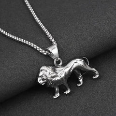 A silver-toned stainless steel lion pendant hangs from a matching box chain necklace.