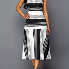 A sleeveless midi dress featuring a black and white striped and dotted patchwork pattern.