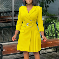 A bright yellow double-breasted blazer dress with a notched collar, belt, and pleated side panel.