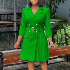 A vibrant green double-breasted blazer dress with a notched collar, belted waist, and pleated side.