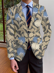 A men's long-sleeve blazer featuring a blue and beige floral print with a button-up front.