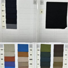 A fabric swatch book displaying various color options for men's suits.