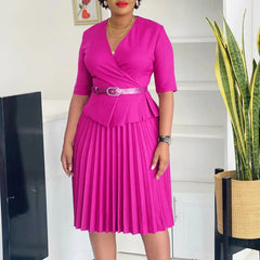 A magenta V-neck midi dress with half sleeves, a pleated skirt, and a matching waist belt.