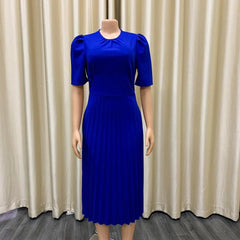 A royal blue midi dress with short puff sleeves, an o-neck, and a pleated skirt.