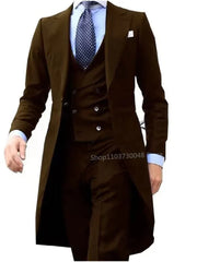 A man wears a dark brown three-piece suit featuring a long tailcoat, vest, and matching trousers.