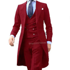 A man wearing a red three-piece suit featuring a tailcoat, vest, and matching trousers.