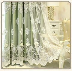 Sage green blackout curtain featuring intricate white floral embroidery and lace detailing.