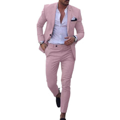 A man wears a slim-fit, single-breasted light pink suit with a white shirt and pocket square.