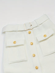 A white high-waisted knit midi skirt featuring a belt, gold-tone buttons, and two front pockets.