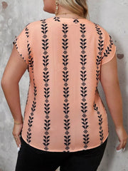 Plus size notched short sleeve blouse from Trendsi, featuring a stylish neckline and comfortable fit, shown on a model.