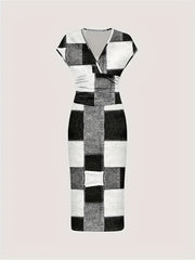 A short-sleeved, V-neck bodycon dress featuring a black and white patchwork plaid print.