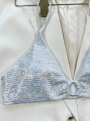 A silver holographic triangle bikini top with a central ring detail.