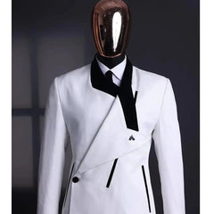 A white slim-fit men's suit jacket featuring a unique black asymmetrical lapel and trim.