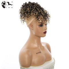A mannequin head displays a curly, blonde-highlighted afro bun hairpiece.