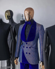 A blue patterned double-breasted tuxedo jacket with a velvet shawl lapel and matching trousers.