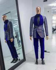 A two-piece men's tuxedo featuring a patterned jacket with a blue shawl lapel and matching pants.