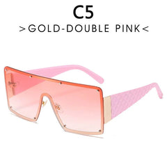 Oversized rimless sunglasses with a pink gradient lens and quilted pink temples.