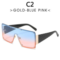 Oversized square sunglasses featuring a blue to pink gradient lens and black textured temples.