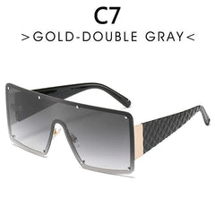 Oversized rimless sunglasses with a gradient gray one-piece lens and textured black temples.