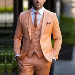 A man wears a formal three-piece orange suit consisting of a blazer, vest, and trousers.