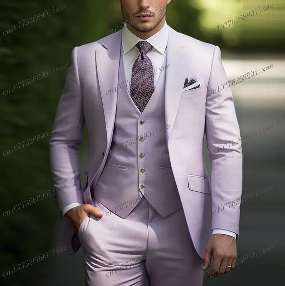 A man wears a light purple three-piece suit consisting of a blazer, vest, and trousers.