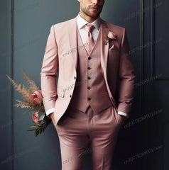 A man wears a formal three-piece orange suit consisting of a blazer, vest, and trousers.