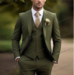 A man wears a formal olive green three-piece suit with a white shirt and a textured tie.