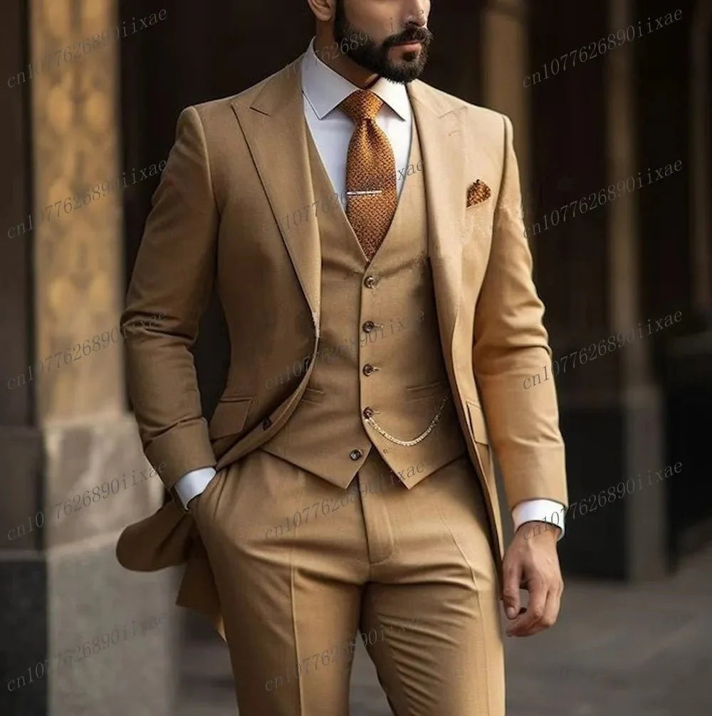 A man wears a formal orange three-piece suit consisting of a blazer, vest, and trousers.