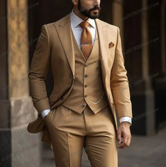 A man wears a formal orange three-piece suit consisting of a blazer, vest, and trousers.