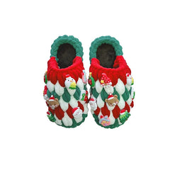 A pair of handmade, chunky crochet Christmas slippers featuring red, white, and green yarn with festive holiday charms.