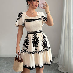 Elegant Mini Dress with a Square Neckline, Featuring Fashionable Prints, Pleats, a Cinched Waist for a Slimming Effect, And Ruffled Edges with an A-Line Hem.